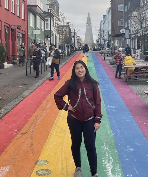 Michelle Ramirez stands on Rainbow Street in Reykjavik, Iceland, while attending the Arctic Circle Assembly in October 2023.