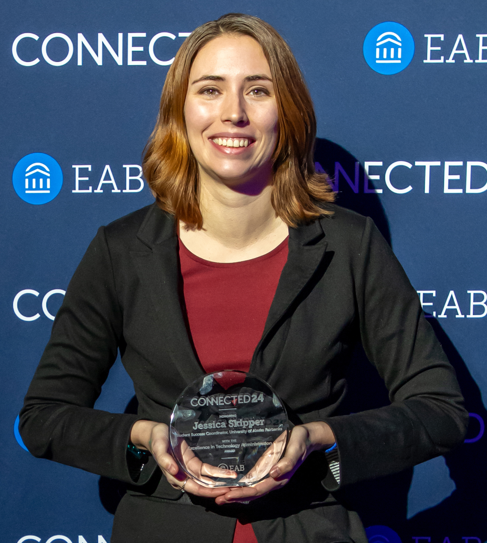 Jessica Skipper with her Excellence in Technology Administration Award from EAB presented at the CONNECTED24 conference.